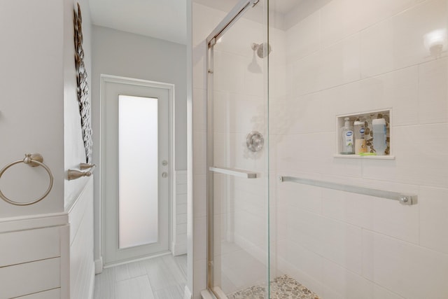 full bath with a shower stall
