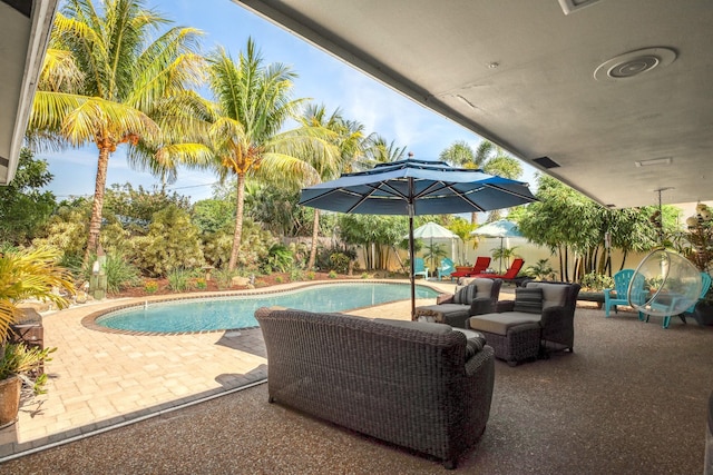 view of pool featuring a patio and a fenced backyard