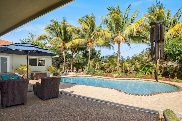swimming pool featuring a patio area
