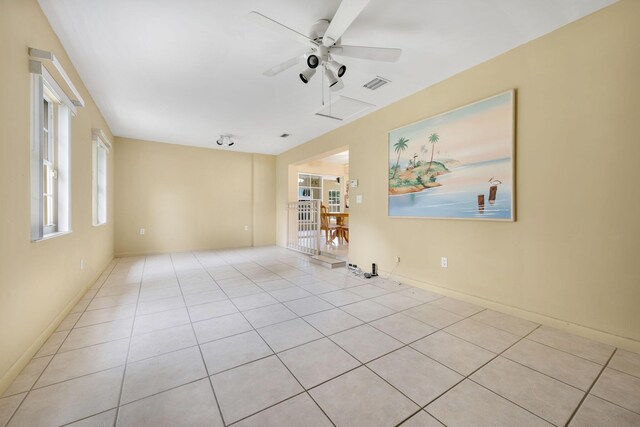 1401 Shore Dr, Lake Clarke Shores, FL 33406 - tiled spare room with a ceiling fan and baseboards
