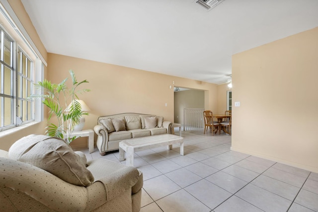 1401 Shore Dr, Lake Clarke Shores, FL 33406 - living room with light tile patterned flooring and baseboards