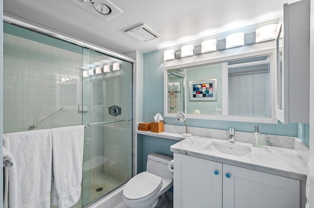 901 E Camino Real Unit 4C, Boca Raton, FL 33432 - full bathroom featuring toilet, a shower stall, and vanity