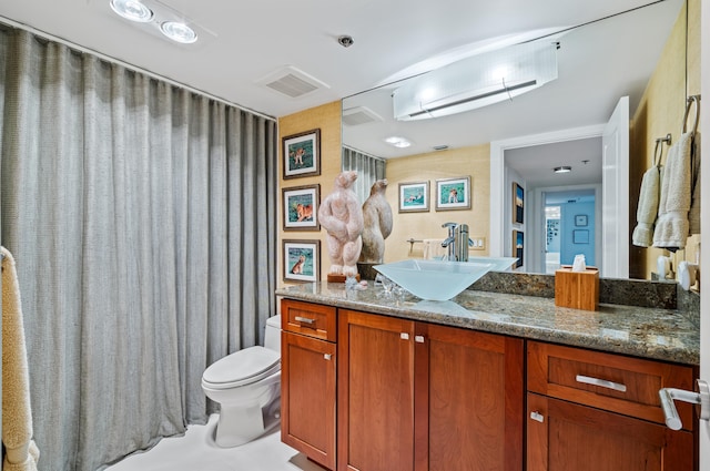 901 E Camino Real Unit 4C, Boca Raton, FL 33432 - bathroom with toilet and vanity
