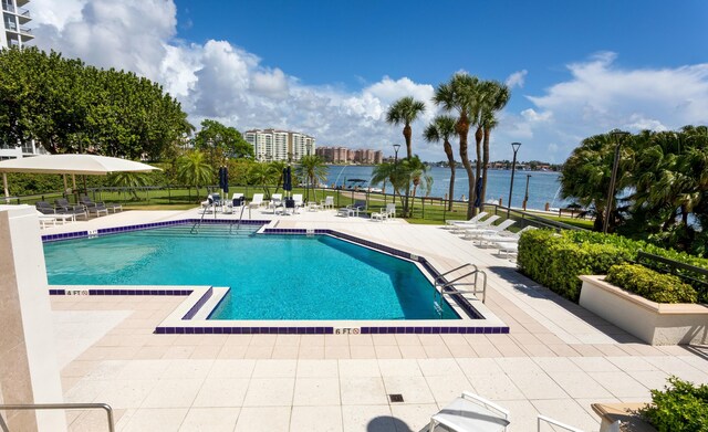 901 E Camino Real Unit 4C, Boca Raton, FL 33432 - community pool with a patio area, fence, and a water view