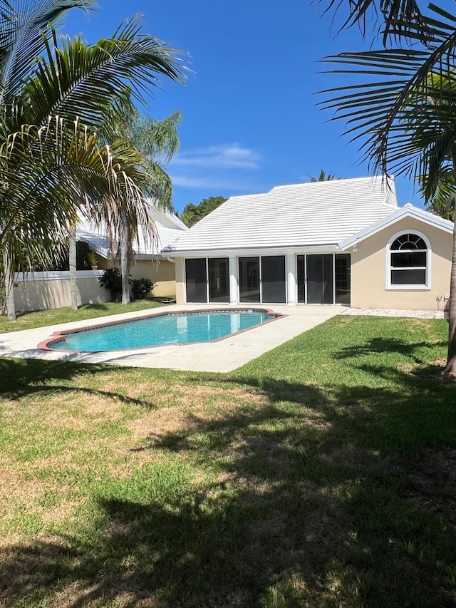 view of swimming pool with a sunroom