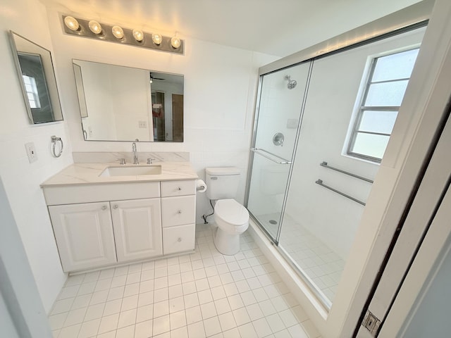 1036 Hythe B B, Boca Raton, FL 33434 - full bathroom with vanity, a stall shower, tile patterned flooring, and tile walls