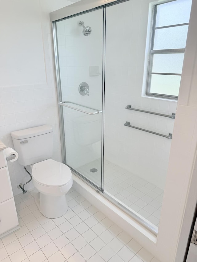 1036 Hythe B B, Boca Raton, FL 33434 - full bathroom featuring a stall shower, tile patterned flooring, and tile walls