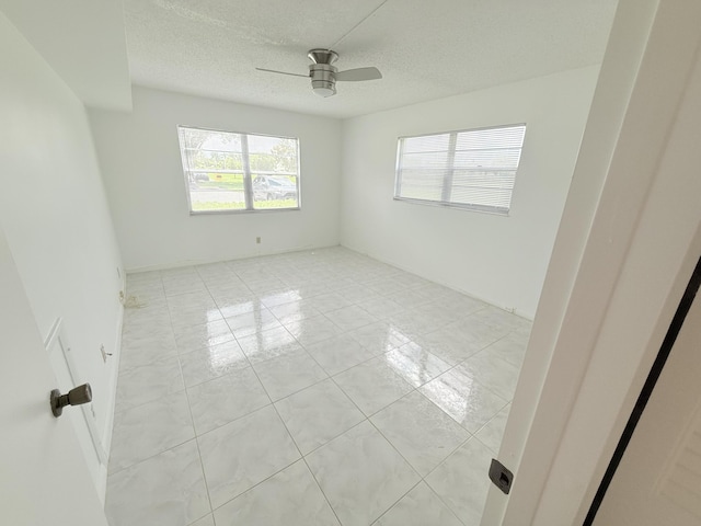 1036 Hythe B B, Boca Raton, FL 33434 - unfurnished room with ceiling fan, a textured ceiling, and light tile patterned flooring