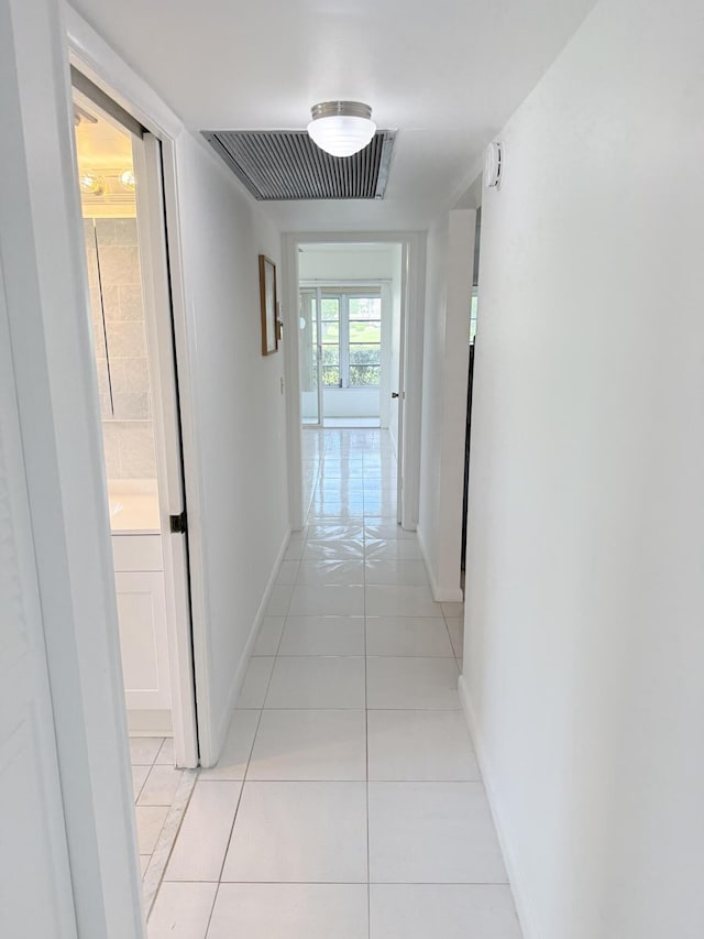 1036 Hythe B B, Boca Raton, FL 33434 - hall featuring light tile patterned floors and baseboards