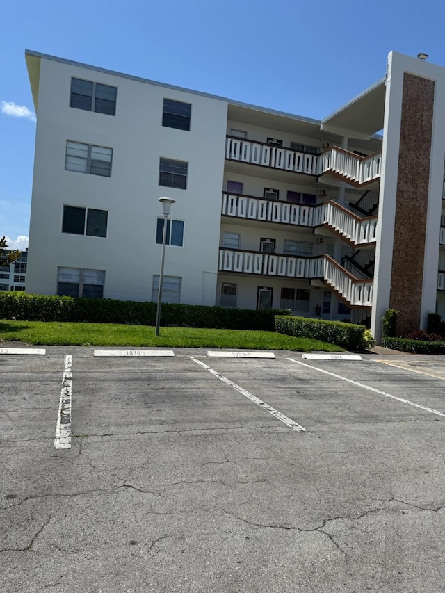 view of property featuring uncovered parking