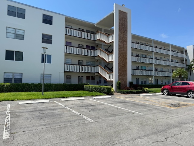 1036 Hythe B B, Boca Raton, FL 33434 - view of apartment building / complex with uncovered parking