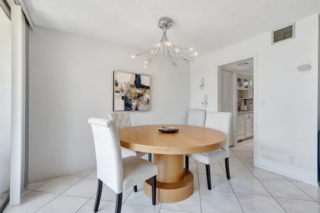 903 Bridgewood Pl, Boca Raton, FL 33434 - dining room with a chandelier, a textured ceiling, and light tile patterned floors