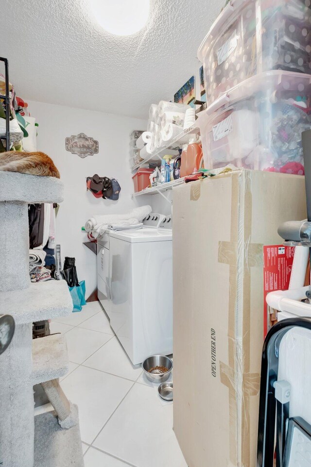 903 Bridgewood Pl, Boca Raton, FL 33434 - laundry room featuring separate washer and dryer, tile patterned floors, and a textured ceiling