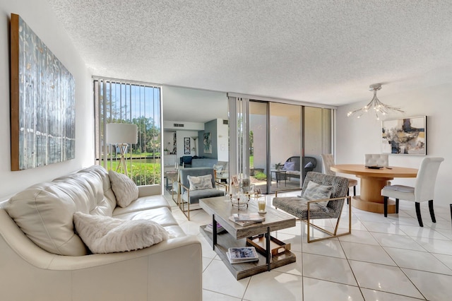 903 Bridgewood Pl, Boca Raton, FL 33434 - living area featuring a chandelier, floor to ceiling windows, a textured ceiling, and light tile patterned floors
