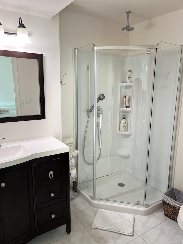 311 Pine Ridge Cir Unit B-1, Greenacres, FL 33463 - full bathroom featuring a shower stall, vanity, tile patterned floors, and toilet