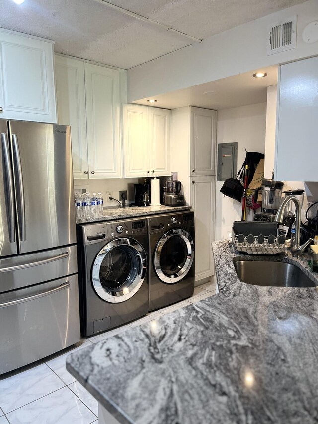 311 Pine Ridge Cir Unit B-1, Greenacres, FL 33463 - washroom featuring separate washer and dryer and electric panel