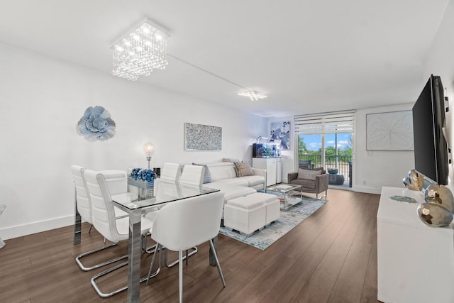 5500 NW 2nd Ave Unit 414, Boca Raton, FL 33487 - dining space featuring wood finished floors, a chandelier, and baseboards