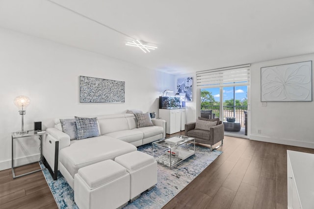 5500 NW 2nd Ave Unit 414, Boca Raton, FL 33487 - living area featuring dark wood finished floors and baseboards