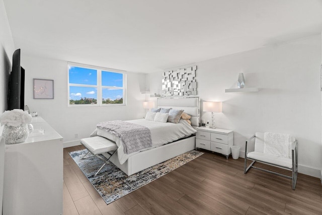 5500 NW 2nd Ave Unit 414, Boca Raton, FL 33487 - bedroom with dark wood-style flooring and baseboards