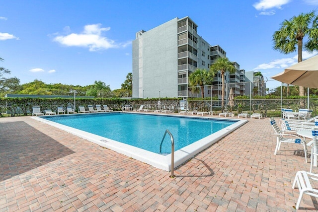 5500 NW 2nd Ave Unit 414, Boca Raton, FL 33487 - community pool with fence and a patio area