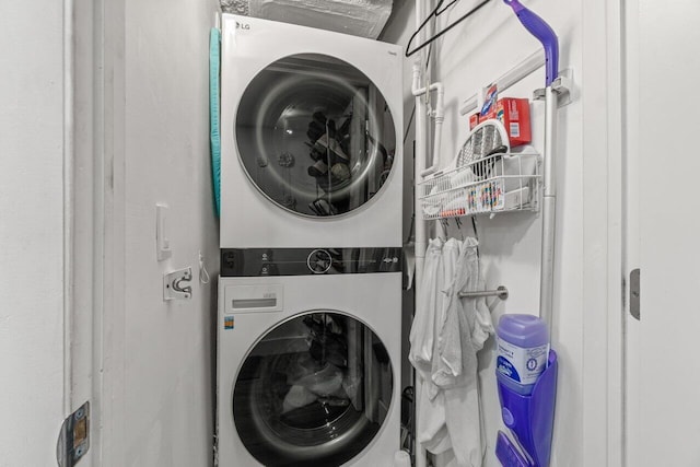 5500 NW 2nd Ave Unit 414, Boca Raton, FL 33487 - laundry area featuring stacked washer / drying machine