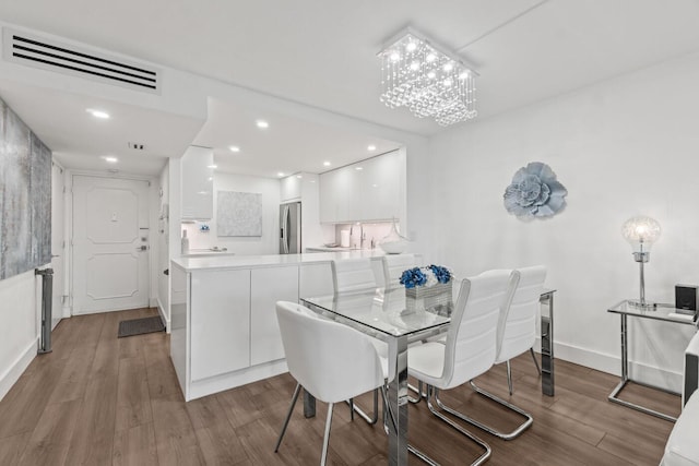 5500 NW 2nd Ave Unit 414, Boca Raton, FL 33487 - dining room with wood finished floors and recessed lighting
