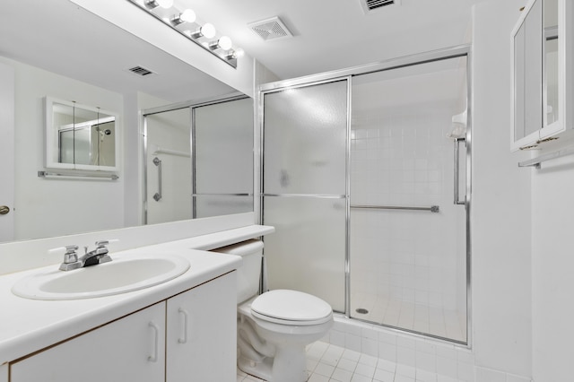 full bathroom featuring a shower stall, toilet, tile patterned floors, and vanity