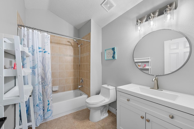 bathroom featuring toilet, tile patterned floors, vaulted ceiling, shower / bath combo, and vanity