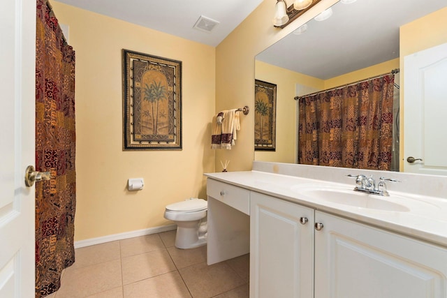 2149 SE Grand Dr, Port Saint Lucie, FL 34952 - bathroom with tile patterned floors, toilet, baseboards, and vanity