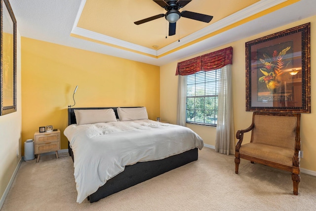 2149 SE Grand Dr, Port Saint Lucie, FL 34952 - carpeted bedroom with crown molding, a tray ceiling, baseboards, and a ceiling fan