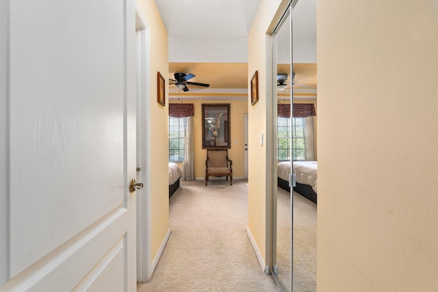 2149 SE Grand Dr, Port Saint Lucie, FL 34952 - hall featuring light colored carpet, plenty of natural light, and baseboards