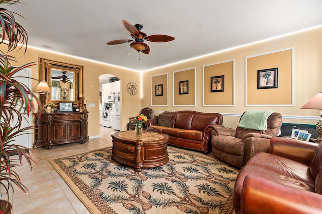 2149 SE Grand Dr, Port Saint Lucie, FL 34952 - living area with a ceiling fan, light tile patterned floors, and arched walkways