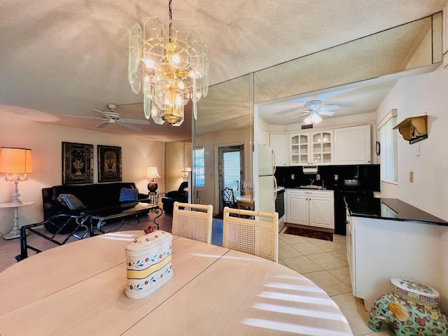100 Sheffield E, West Palm Beach, FL 33417 - dining space with ceiling fan, light tile patterned floors, and a chandelier