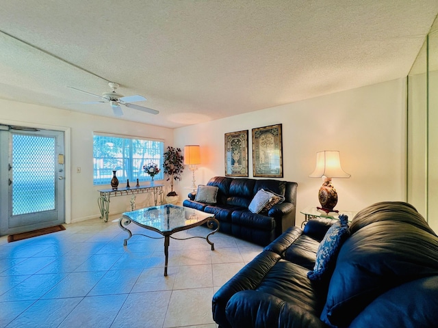 100 Sheffield E, West Palm Beach, FL 33417 - living room with ceiling fan, light tile patterned flooring, and a textured ceiling