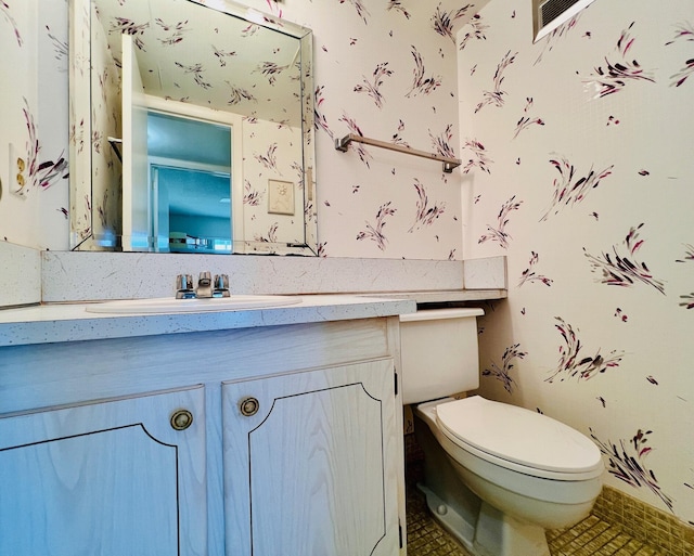 100 Sheffield E, West Palm Beach, FL 33417 - half bath featuring vanity and tile patterned floors