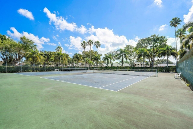 view of tennis court with fence