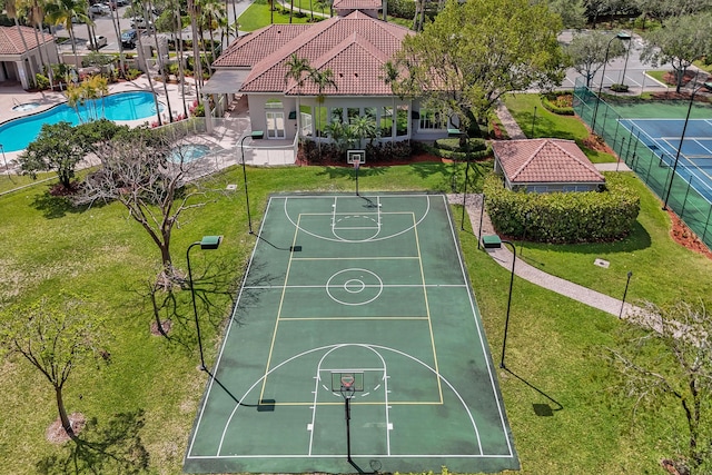 view of sport court featuring community basketball court and a community pool