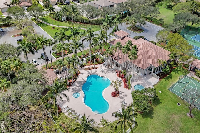 aerial perspective of suburban area with a pool area