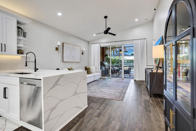 kitchen with ceiling fan, stainless steel dishwasher, open shelves, a sink, and white cabinets