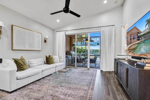 living area with a ceiling fan, lofted ceiling, dark wood-style floors, and recessed lighting