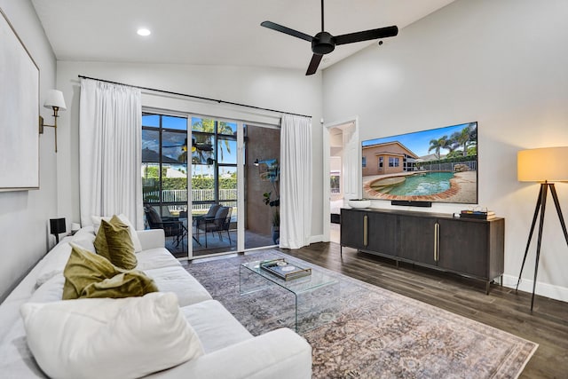 living area featuring ceiling fan, wood finished floors, baseboards, high vaulted ceiling, and recessed lighting