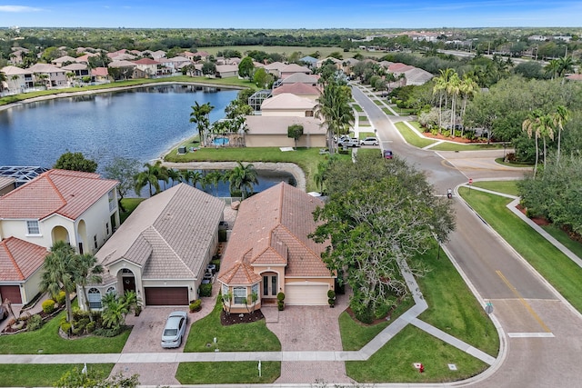 aerial view of residential area featuring a nearby body of water