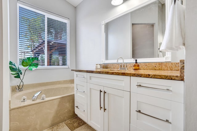 full bath with a garden tub and vanity