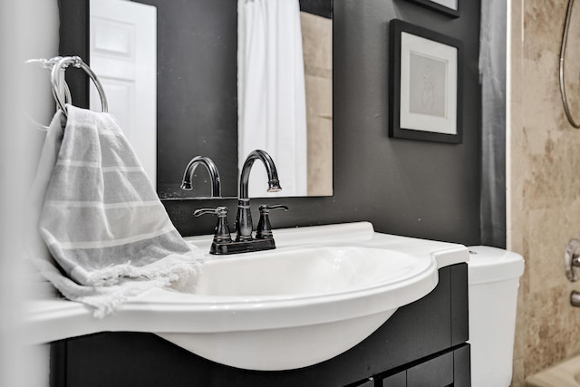 bathroom with vanity and toilet