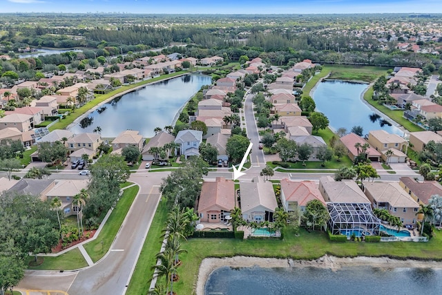 view of property location featuring nearby suburban area and a nearby body of water