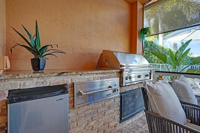 view of patio / terrace with a grill and an outdoor kitchen