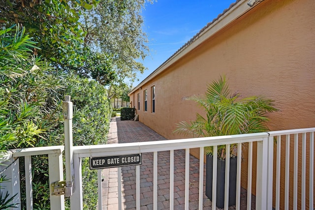 view of side of home with stucco siding