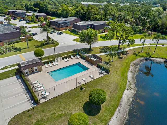 bird's eye view of a nearby body of water and a pool
