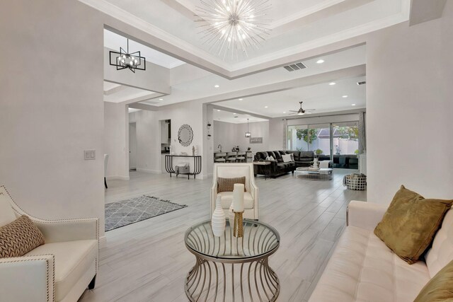 living room with a chandelier, recessed lighting, ceiling fan, and crown molding