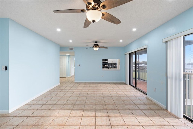 spare room featuring ceiling fan, recessed lighting, baseboards, and light tile patterned floors
